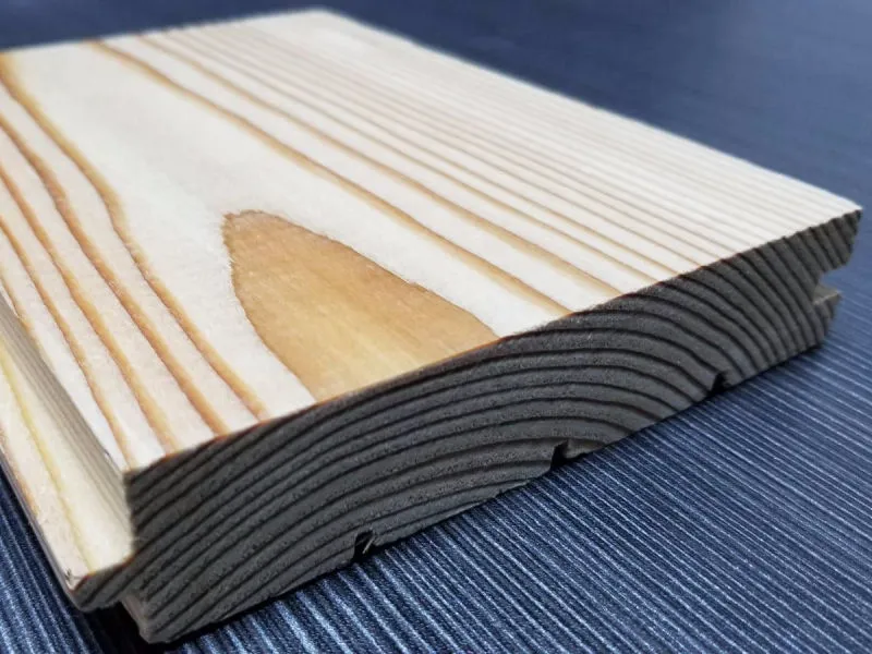 Stacked Siberian larch timber staged for wholesale supply